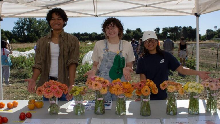 UC Davis SCOPE prgoram undergraduates with zinnias