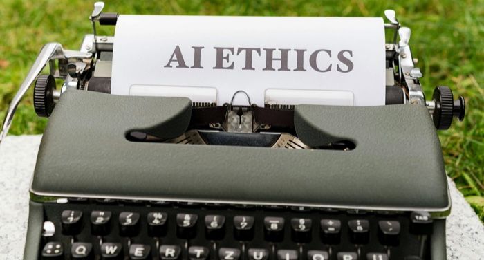 a type writer with a page coming out of it that says 22AI ETHICS22.jpg.optimal