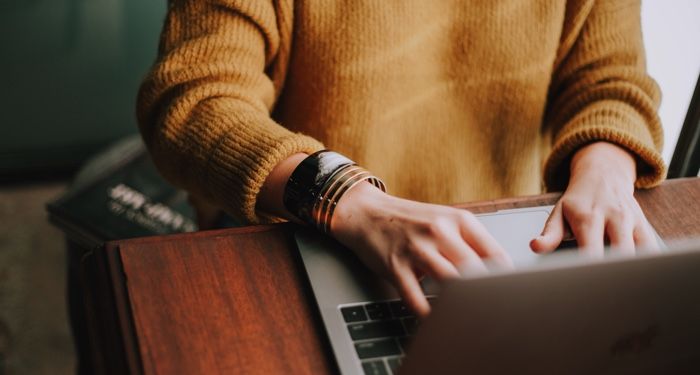 woman writing on laptop feature 700x375 1.jpg.optimal