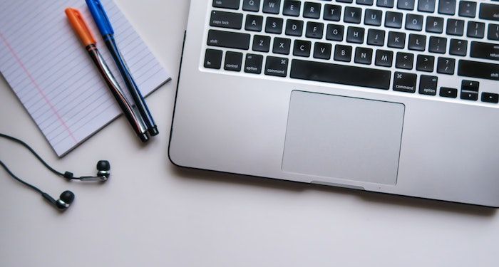 image of computer pens notepad and earbuds.jpg.optimal